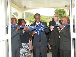 THA Chief Secretary Orville London cuts the ribbon to officially opening the new $28 million Scarborough Health Centre at Bacolet Park on Tuesday. Photo courtesy THA Information Dept.