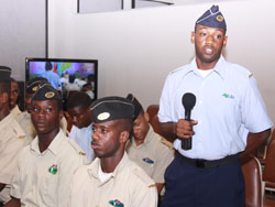 Lone Tobagoian in the MILAT program Dave Clarke relates his experience to THA Chief Secretary Orville London on Monday. (11th July 2011).