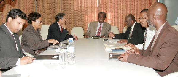 THA Chief Secretary Orville London (centre) presides at a meeting of THA and NIB officials at his office on Thursday. (14th March 2013) Others in photo from left are Ashook Balroop, Manager Legal Services, NIB; Karen Gopaul, CEO, NIB, Harry Hospedales, Director, NIB; Dr Ellis, Chief Administrator, THA; Alvin Pascall, Senior State Counsel, NIB; and Norris Jack, Senior Adviser, THA. Photo courtesy THA Information Dept.