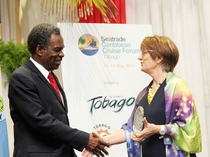 THA Chief Secretary Orville London shakes hands with Global Events Director and Managing Director of Seatrade Middle East, Vanessa Stephens, at the forum.