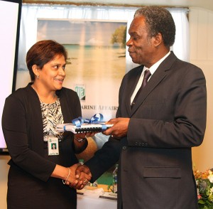 THA Chief Secretary Orville London is presented with reports on climate change adaptation and coastal zone management in Tobago by Dr Rahanna Juman on behalf of the IMA. Photo courtesy THA.