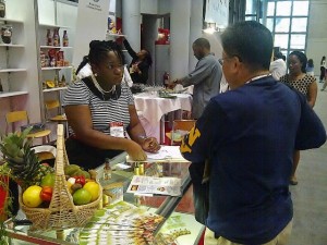 Mrs. Darilyn Smart, President of Tobago Agro Processors Association engages a potential client at the Sumer Fancy Food Show.