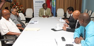 THA Chief Secretary, centre, chairs the meeting between officials of the THA and the PATT.