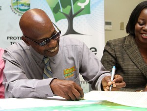 One of the beneficiaries of Venture Capital Equity Fund, Mr. Elvis Charles of Andy’s Company Limited signing the shareholders agreement.