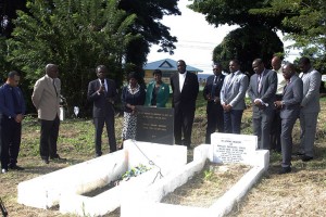 THA Chief Secretary Orville London pays tribute to former president and prime minister of Trinidad and Tobago, Arthur Napoleon Raymond Robinson, while Presiding Officer Kelvin Charles, second from left, Secretary of the Division of Health and Social Services Claudia Groome-Duke, fourth from left, and other Tobago House of Assembly representatives look on. 