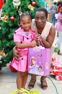 Director of Finance and Enterprise Development, Mrs. Esther Pilgrim-Soanes with an adorable little lady at the Division’s Christmas Party which was held on the 29th November, 2015 at the Victor E. Bruce Financial Complex.