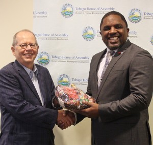 Taste of Tobago: Secretary of Finance and Enterprise Development, Assemblyman Joel Jack presents a gift basket of products made by local entrepreneurs to Canada’s High Commissioner to Trinidad and Tobago, His Excellency Gerard Latulippe after the opening ceremony of the Public Private Partnership Workshop at the Victor E. Bruce Financial Complex on 23rd March, 2016. 