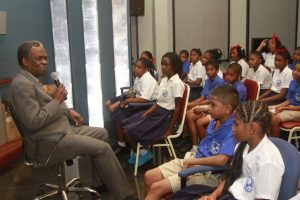 THA Chief Secretary Orville London chats with the students of Biche RC Primary School.